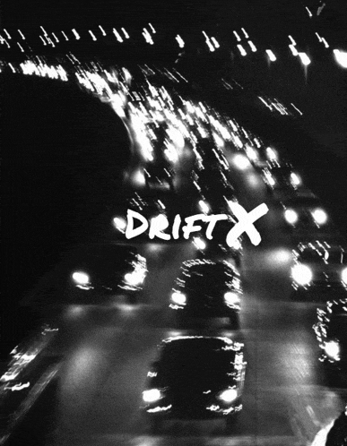 a black and white photo of a highway with drift x written in white
