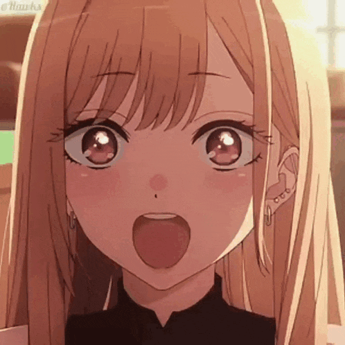 a close up of a blonde anime girl with her tongue out .