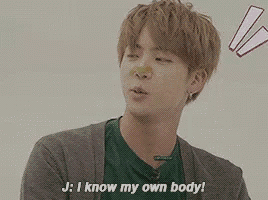 a young man with a green shirt on says j : i know my own body .