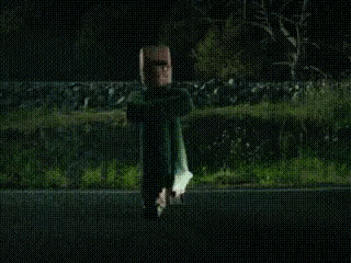 a person is flying through the air in a dark room .