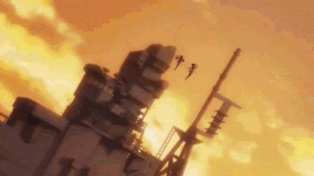 a group of people are flying through the air over a building .
