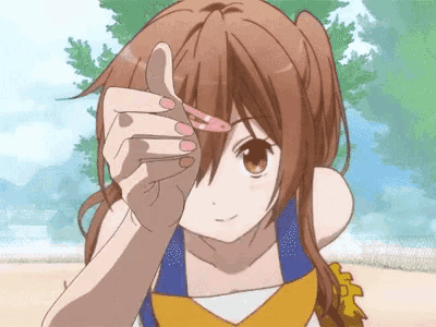 a girl in a cheerleader outfit is holding a hair clip to her face