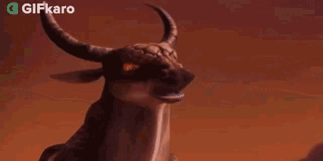 a close up of a cartoon bull with horns and a huge mouth .