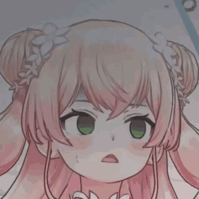 a close up of a girl with pink hair and green eyes making a funny face .