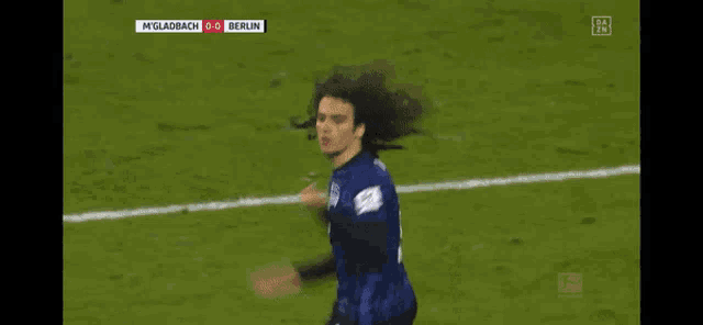 a soccer player celebrates a goal during a game against berlin