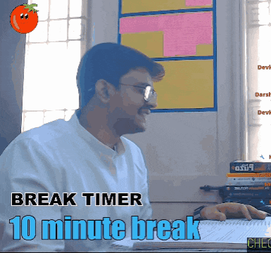 a man is sitting at a desk with a break timer of 10 minutes