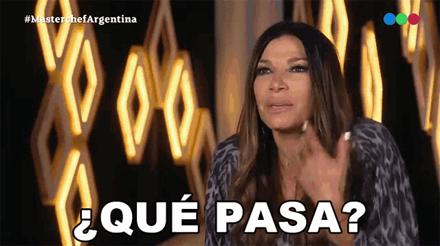 a woman in a leopard print shirt says " que pasa " in spanish