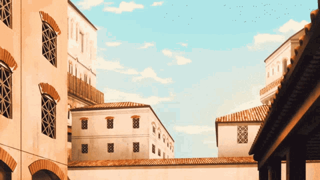 a row of buildings with arched windows and a blue sky behind them