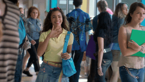 a girl with a blue bag that says starbucks