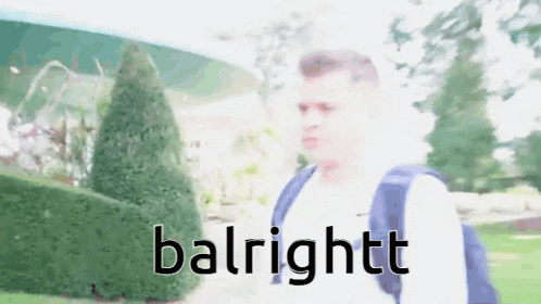 a blurry picture of a man with a backpack and the word balrightt on the bottom