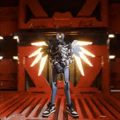a robot with wings is standing in front of a red building