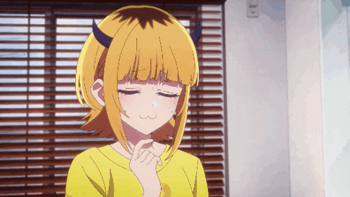 a girl with horns and a yellow shirt is crying