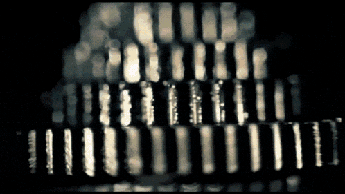 a black and white photo of a pyramid with a few lines