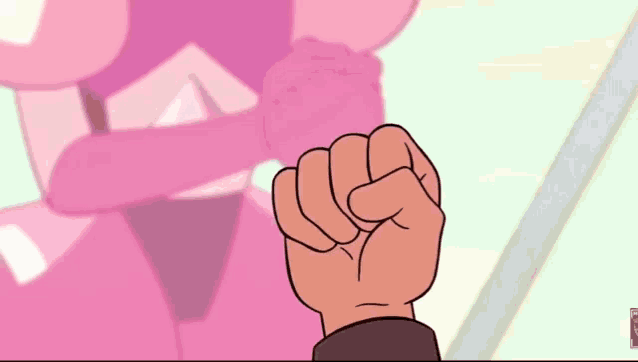 a fist is being held up in front of a pink diamond