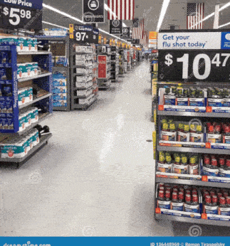 an aisle in a store with a sign that says " get your flu shot today "