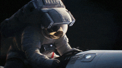 a man in a space suit is looking at something