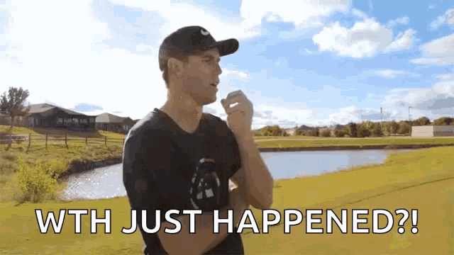 a man standing on a golf course with the words " wth just happened " on the bottom