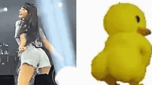 a woman is dancing on stage next to a yellow rubber duck .