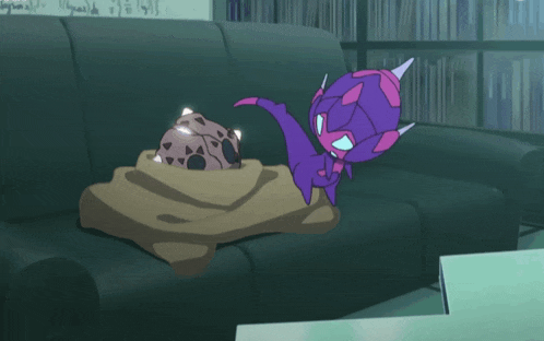 a purple and pink cartoon character is standing next to a blanket