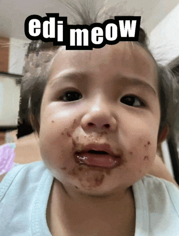 a baby with a messy face and the words edi meow on it