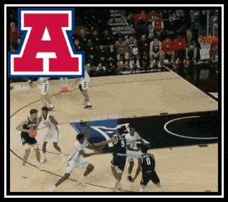 a basketball game is being played on a court with the letter a in the background