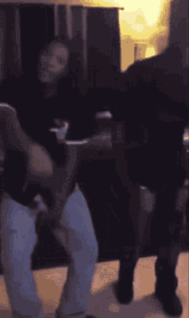 a blurred image of a person holding a cup of coffee