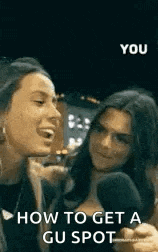 two women are talking to each other in front of microphones and a text that says `` how to get a gu spot '' .