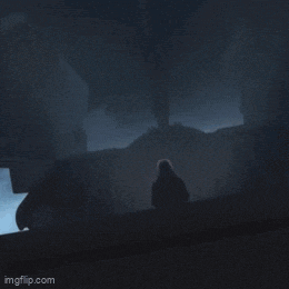 a close up of a person riding a motorcycle in the dark