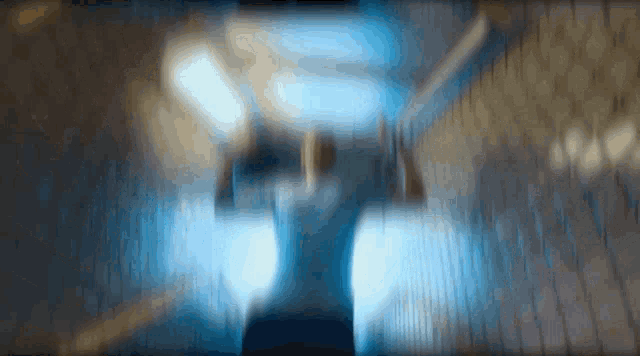 a blurry photo of a person walking down stairs
