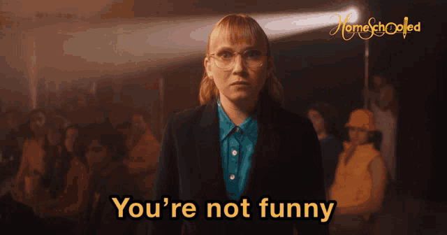 a woman says you 're not funny in front of a group of people