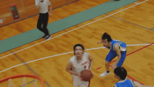 a basketball is going through a hoop with a blurred image