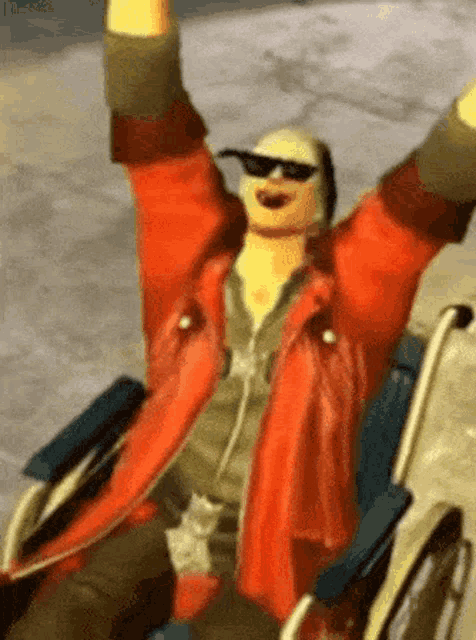 a person in a wheelchair with their arms in the air