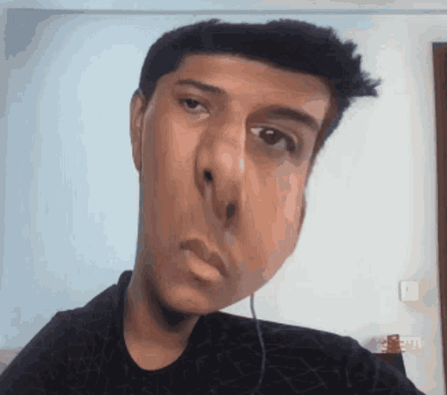 a close up of a man 's face with a large nose