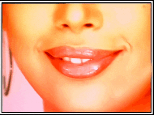 a close up of a woman 's mouth with a smile on her face