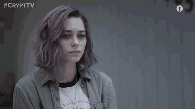a girl with purple hair is on a facebook ad