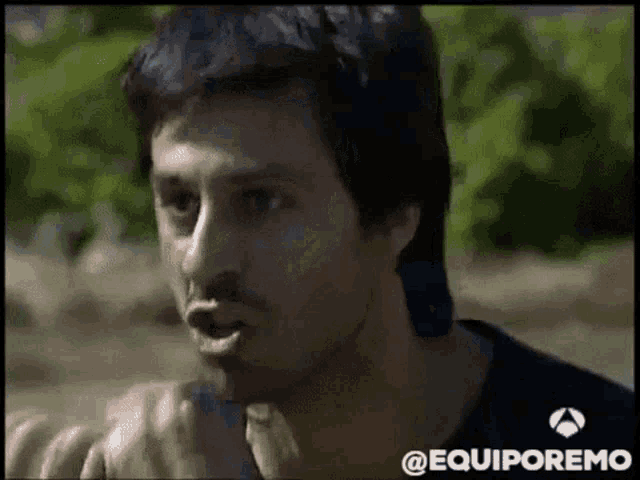 a close up of a man 's face with the words @equiporemo on the bottom right