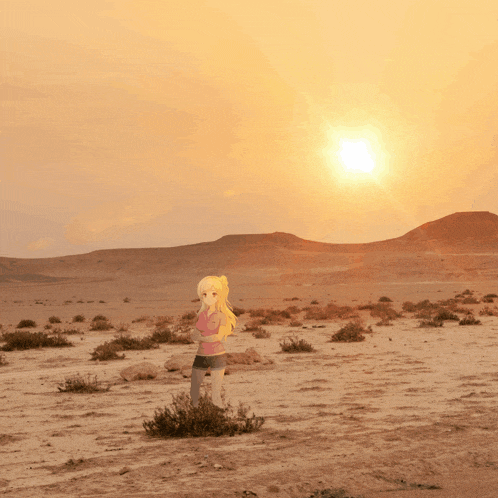 a girl in a pink shirt stands in a desert at sunset