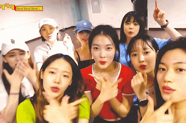 a group of young women are posing for a picture with the words bang bang bang on the bottom right