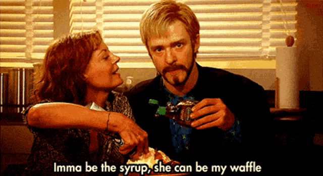 a man is pouring syrup into a woman 's waffle