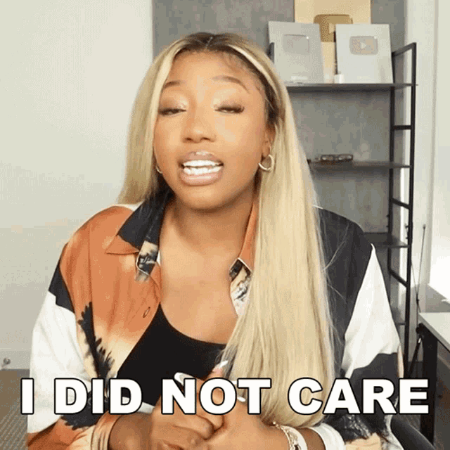 a woman says " i did not care " while wearing a tie dye shirt