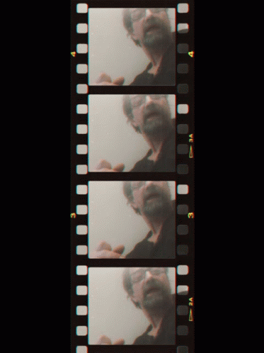 a row of film strips showing a man with a beard