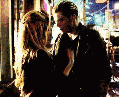 a man and a woman are looking into each others eyes