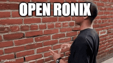 a man is standing in front of a brick wall and says open ronix