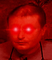 a man with red eyes and a stethoscope around his neck is looking at the camera .