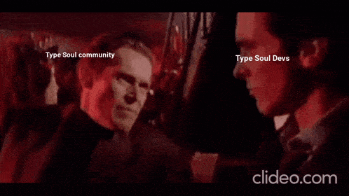 a man is dancing in a club with a woman behind him .