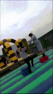 a group of people are playing on a bouncy castle that says harry potter on it