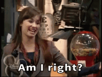 a woman is standing in front of a gumball machine and says am i right .