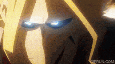 a close up of a person 's face with glowing blue eyes .