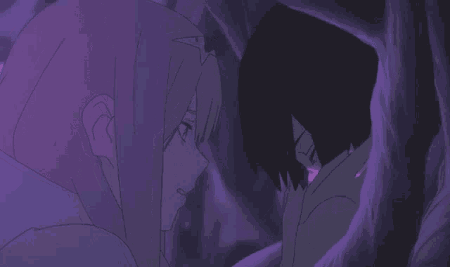 a man and a woman are looking at each other