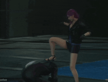 a video game screen shows a woman kicking a man in the face